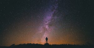 NightSkySilhouette Man standing under stars