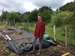 Young woman in veg garden