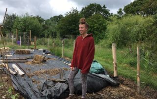 Young woman in veg garden