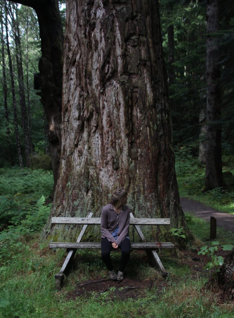 Girl sitting beneath a tree