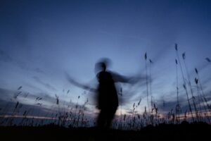 Person dancing in the dark